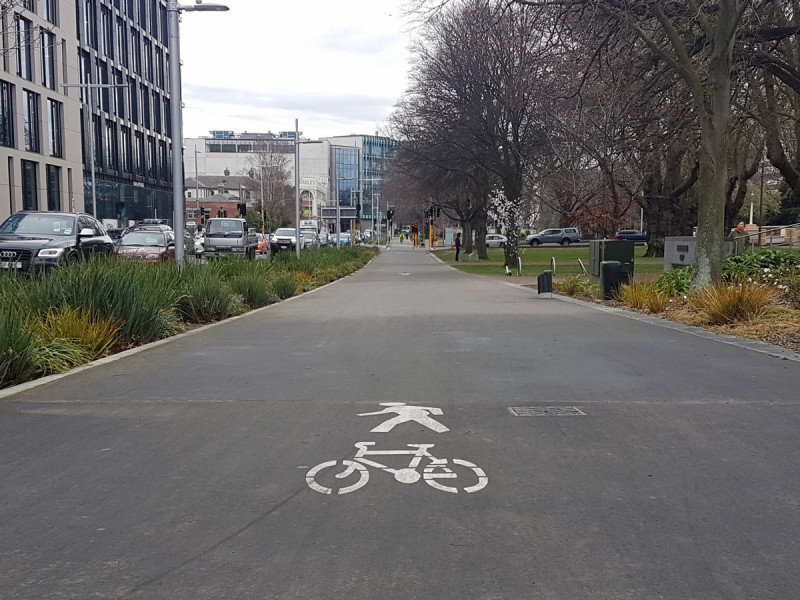 wide shared path with painted pedestrian and bike symbol