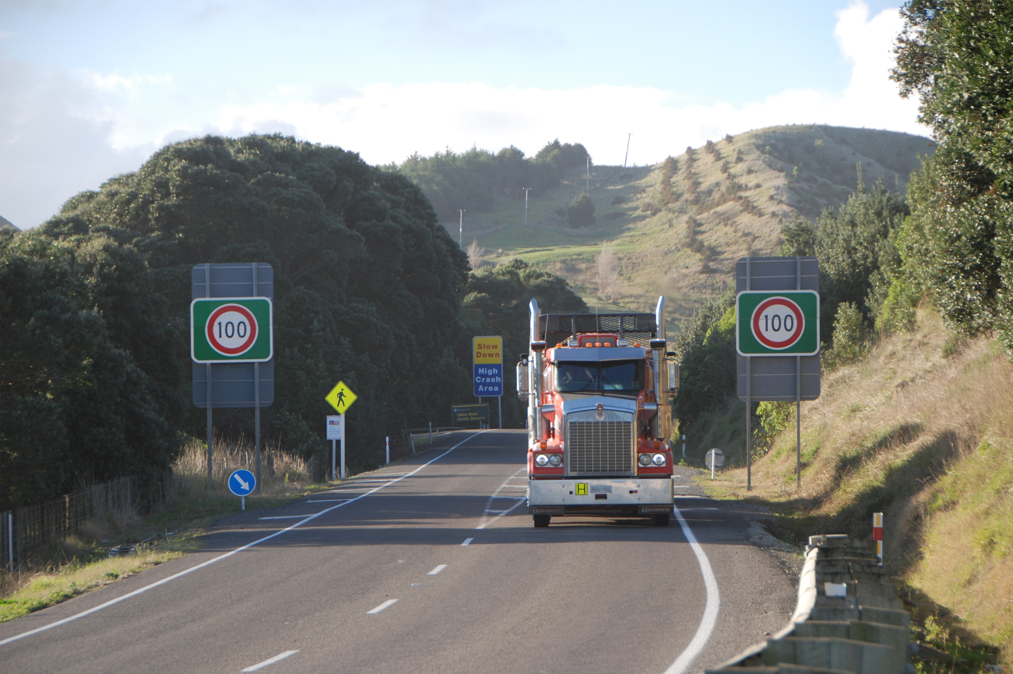 View of a truck coming towards the camera on a rural road with no passing lanes.